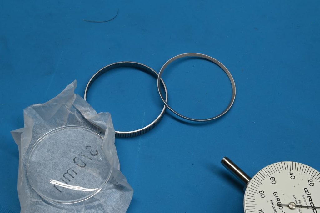 photo of a bezel and new crystal for a Girod dial test indicator ready for installation