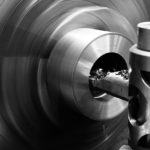 Black and white workshop photo lathe turning